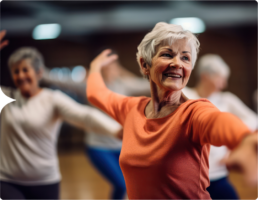 Photograph of an older caucasian woman in a dance class, the AZUR Study for adults with colon cancer